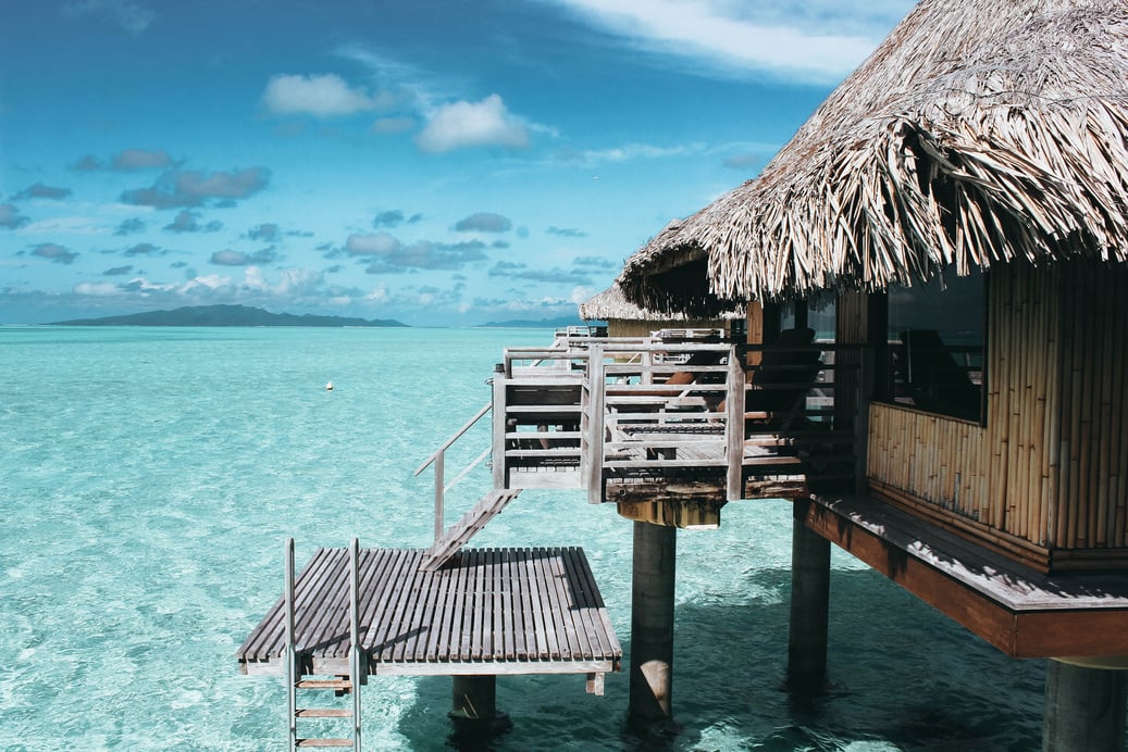 Brown Nipa Hut on Body of Water